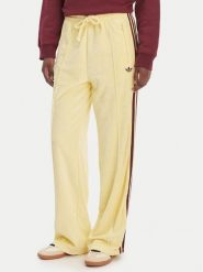 Adidas Spodnie dresowe Terry Towel Firebird KQ6662 Żółty Loose Fit. Żółte spodnie dresowe adidas, bez wzorów, z bawełny. Za 348.99 zł.