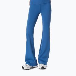 Legginsy treningowe damskie Cardio Bunny Flare. Niebieskie legginsy Cardio Bunny, bez wzorów, z elastanu, eleganckie. Za 189.99 zł.