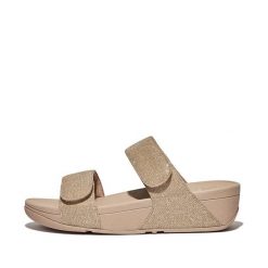 Kobiece klapki na koturnie FitFlop Lulu Adjustable. Brązowe klapki FIT FLOP, bez wzorów, z materiału, eleganckie, bez obcasa, na koturnie, bez zapięcia. Za 510.00 zł.