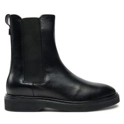 Sztyblety Calvin Klein. Czarne botki Calvin Klein, bez wzorów, bez obcasa, na płaskiej podeszwie, bez zapięcia. Za 529.99 zł.