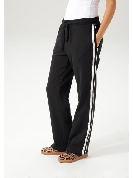 Aniston Spodnie dresowe w kolorze czarnym rozmiar: 38. Czarne spodnie dresowe Aniston, bez wzorów, z dresówki. Za 109.26 zł.