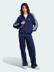 Adidas Spodnie dresowe "Firebird" w kolorze granatowym rozmiar: S. Niebieskie spodnie dresowe adidas, bez wzorów, z dresówki. Za 132.05 zł.