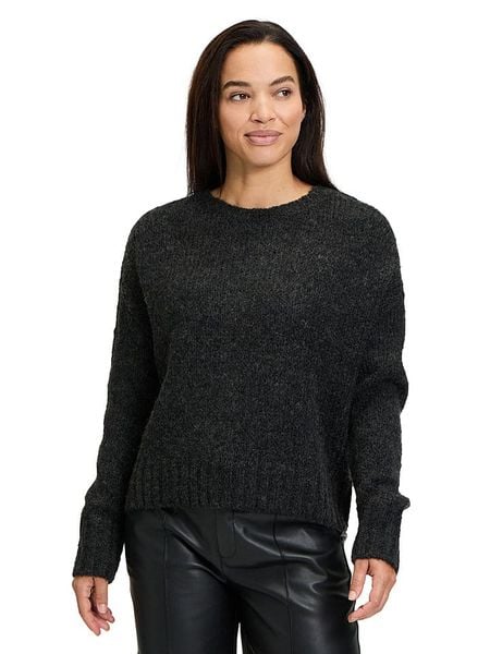 CARTOON Sweter w kolorze czarnym rozmiar: 40. Czarne swetry Cartoon, bez wzorów, z wełny, bez ramiączek. Za 113.90 zł.