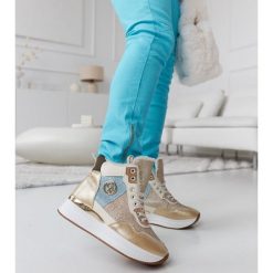 Złote ocieplane sneakersy z brokatem Deleon złoty. Żółte botki bez wzorów, eleganckie, z okrągłym noskiem, przed kolano, bez obcasa, bez zapięcia. Za 169.07 zł.