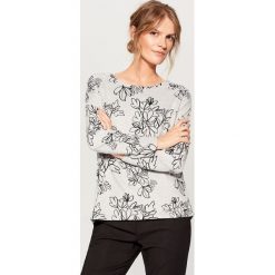 Dzianinowy sweter w kwiaty - Czarny. Swetry marki INESIS. W wyprzedaży za 49.99 zł.