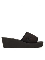 Calvin Klein Jeans Klapki Beach Wedge Slide Canvas YW0YW01725 Czarny. Czarne klapki Calvin Klein Jeans, bez wzorów, z jeansu, bez obcasa, bez zapięcia. Za 139.99 zł.