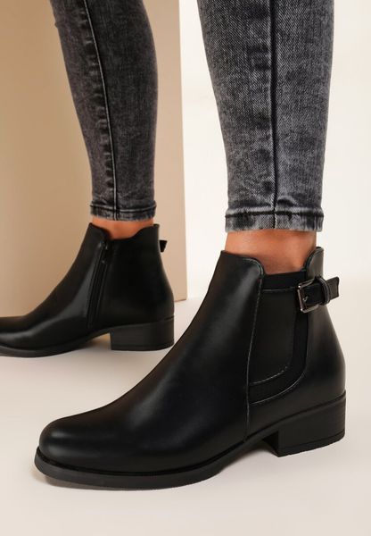 Czarne Botki Density. Czarne botki Renee, bez wzorów, z okrągłym noskiem, za kostkę, bez obcasa, na płaskiej podeszwie, bez zapięcia. Za 99.99 zł.