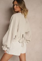 Beżowa Bawełniana Bluzka Typu Nietoperz z Wiązaniem Sepionna. Brązowe bluzki Renee, bez wzorów, z bawełny, eleganckie, bez kołnierzyka, bez ramiączek. W wyprzedaży za 87.99 zł.