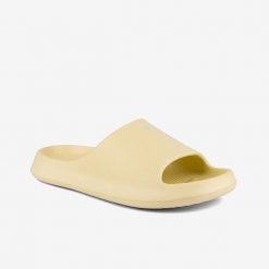 Klapki damskie Coqui Coquiair pastelowe żółte. Żółte klapki Coqui, bez wzorów, z materiału, eleganckie, bez obcasa, bez zapięcia. Za 112.99 zł.