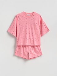 Dwuczęściowa piżama w serca - intensywny róż. Czerwone piżamy Reserved, l, bez wzorów, z bawełny, bez kołnierzyka, bez ramiączek. Za 59.99 zł.