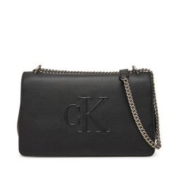 Torebka Calvin Klein Jeans. Czarne kopertówki Calvin Klein Jeans, bez wzorów, z jeansu, wizytowe, bez dodatków. Za 389.99 zł.