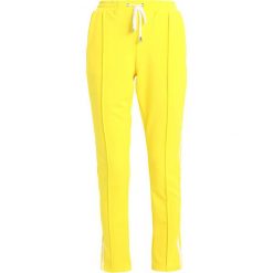 Missguided DOUBLE SIDE STRIPE Spodnie treningowe yellow. Spodnie dresowe Missguided. Za 149.00 zł.