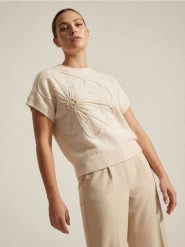 Sweter bez rękawów z tłoczonym kwiatem - biały. Białe swetry Sinsay, l, bez wzorów, bez ramiączek. Za 49.99 zł.