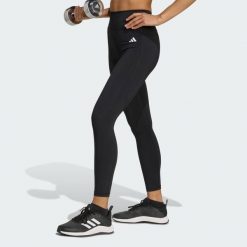 Legginsy 7/8 bez szwu z przodu Optime Essentials. Czarne legginsy adidas, bez wzorów, sportowe. Za 219.00 zł.