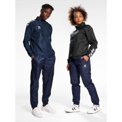 Bieganie Hummel All-weather. Niebieskie szorty Hummel, bez wzorów, z materiału, sportowe. Za 229.00 zł.