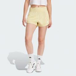 Szorty Pacer Essentials Knit High-Rise. Białe szorty sportowe adidas, bez wzorów, z materiału, na fitness i siłownię. Za 126.30 zł.