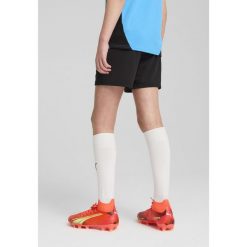 Młodzieżowe szorty treningowe Olympique Marsylia PUMA Black Copper Metallic. Czarna szorty sportowe Puma, bez wzorów, do piłki nożnej. W wyprzedaży za 154.00 zł.