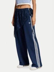Adidas Spodnie dresowe 2In1 Firebird Loose Track Trousers With Lace Skirt LG4273 Niebieski Relaxed Fit. Niebieskie spodnie dresowe adidas, bez wzorów, z bawełny. Za 369.99 zł.