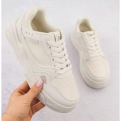 Buty damskie sportowe Big Star NN274668 beżowe beżowy. Brązowe buty treningowe bez wzorów, bez zapięcia. W wyprzedaży za 217.19 zł.