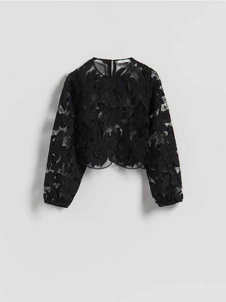 Bluzka z haftowanym wzorem - czarny. Czarne bluzki Reserved, l, bez wzorów, z dzianiny, bez kołnierzyka, bez ramiączek. Za 159.99 zł.