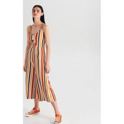 Wzorzysty kombinezon z wycięciem - Biały. Kombinezony Cropp. W wyprzedaży za 39.99 zł.