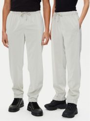 Rains Spodnie przeciwdeszczowe Unisex 18560 Beżowy Regular Fit. Brązowe spodnie sportowe Rains, bez wzorów, z syntetyku, żeglarskie. Za 189.99 zł.