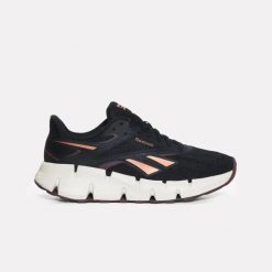Damskie buty do biegania Reebok ZIG DYNAMICA 6 100263921 czarne. Czarne buty do biegania Reebok, bez wzorów, bez zapięcia, do biegania. Za 329.00 zł.