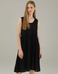 Czarna sukienka z bawełny. Czarne sukienki Unisono, l, bez wzorów, z bawełny, bez kołnierzyka, bez ramiączek, rozkloszowane. Za 129.00 zł.