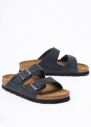 Klapki damskie BIRKENSTOCK ARIZONA LEOI. Brązowe klapki Birkenstock, bez wzorów, biznesowe, bez obcasa, bez zapięcia. Za 439.99 zł.