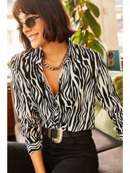 Olalook Bluzka w kolorze czarno-białym rozmiar: L. Czarne bluzki Olalook, l, bez wzorów, z wiskozy, bez kołnierzyka, bez ramiączek. Za 52.55 zł.