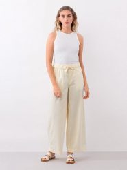 IVY & OAK Spodnie w kolorze jasnożółtym rozmiar: 34. Żółte spodnie materiałowe IVY & OAK, bez wzorów, z materiału. Za 109.78 zł.