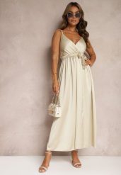 Beżowa Sukienka Wieczorowa o Rozkloszowanym Kroju z Gumką w Pasie i Rozcięciem Relsea. Brązowe sukienki Renee, na imprezę, bez wzorów, eleganckie, bez kołnierzyka, bez ramiączek, maxi, rozkloszowane. W wyprzedaży za 63.99 zł.