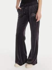 Guess Spodnie dresowe W6RB32 KCUF1 Granatowy Regular Fit. Niebieskie spodnie dresowe Guess, z aplikacjami, z bawełny. Za 389.99 zł.