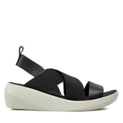 Sandały Fly London. Czarne sandały Fly London, bez wzorów, bez obcasa, na koturnie, bez zapięcia. Za 629.99 zł.