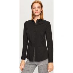 Elegancka koszula - Czarny. Koszule marki QUECHUA. W wyprzedaży za 39.99 zł.