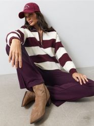 Prążkowane legginsy flare z domieszką bawełny - czerwony. Czerwone legginsy Sinsay, bez wzorów, z bawełny. Za 49.99 zł.
