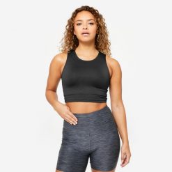 Koszulka fitness damska Domyos bez rękawów crop top. Czarne topy sportowe DOMYOS, l, bez wzorów, z elastanu, na fitness i siłownię. Za 34.99 zł.