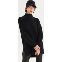 Długi sweter oversize z golfem - Czarny. Swetry marki INESIS. W wyprzedaży za 49.99 zł.