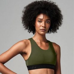 Stanik sportowy damski STRONG ID Essential Sports. Zielone biustonosze sportowe STRONG ID, bez wzorów, z materiału, na fitness i siłownię. Za 89.99 zł.