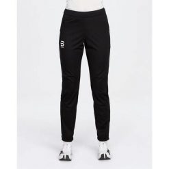 Spodnie narciarskie dla kobiet Daehlie Sportswear Wool 2.0. Czarne spodnie narciarskie DAEHLIE, bez wzorów, z materiału, na fitness i siłownię. Za 873.50 zł.