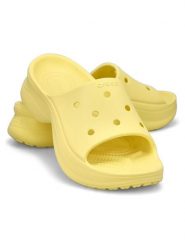 Crocs Klapki "Bae Slide" w kolorze żółtym rozmiar: 39/40. Żółte klapki Crocs, bez wzorów, klasyczne, z otwartym noskiem, bez obcasa, bez zapięcia. Za 155.15 zł.