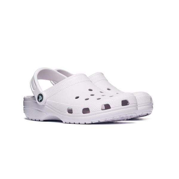 Klapki Crocs CLASSIC 10001-5DK. Fioletowe klapki Crocs, bez wzorów, z materiału, z okrągłym noskiem, bez obcasa, bez zapięcia. Za 199.00 zł.