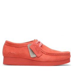 Półbuty Clarks. Pomarańczowe półbuty wsuwane Clarks, bez wzorów, bez obcasa, na płaskiej podeszwie. Za 339.99 zł.