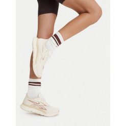 Buty na siłownię Reebok. Białe buty treningowe Reebok, bez wzorów, bez zapięcia, na fitness i siłownię. Za 399.99 zł.
