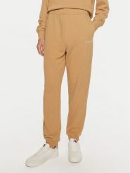Tommy Hilfiger Spodnie dresowe WW0WW42883 Beżowy Regular Fit. Brązowe spodnie dresowe Tommy Hilfiger, bez wzorów, z bawełny. Za 309.99 zł.