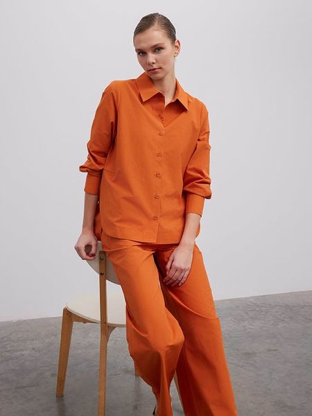 BGN Bluzka w kolorze pomarańczowym rozmiar: 38. Pomarańczowe bluzki BGN, bez wzorów, bez kołnierzyka, bez ramiączek. Za 69.75 zł.