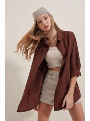 Trendyol Koszula w kolorze ciemnobrązowym rozmiar: 46. Brązowe koszule Trendyol, bez wzorów, z bawełny, bez kołnierzyka, bez ramiączek. Za 70.08 zł.