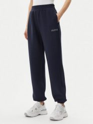 Guess Spodnie dresowe V4BB13 K7UW2 Granatowy Regular Fit. Niebieskie spodnie dresowe Guess, z aplikacjami, z dresówki. Za 199.99 zł.