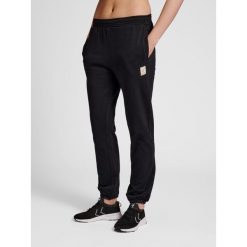 Spodnie damskie do joggingu Hummel sweat. Czarne spodnie dresowe Hummel, bez wzorów, z dresówki. Za 201.00 zł.