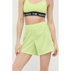 The North Face szorty sportowe Freedom damskie kolor zielony gładkie high waist. Zielone szorty sportowe The North Face, bez wzorów, z materiału, z podwyższonym stanem. W wyprzedaży za 84.99 zł.